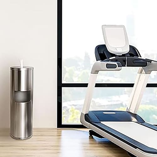 Stainless steel gym wipes dispenser mounted on the wall near fitness equipment in a UAE or GCC gym.